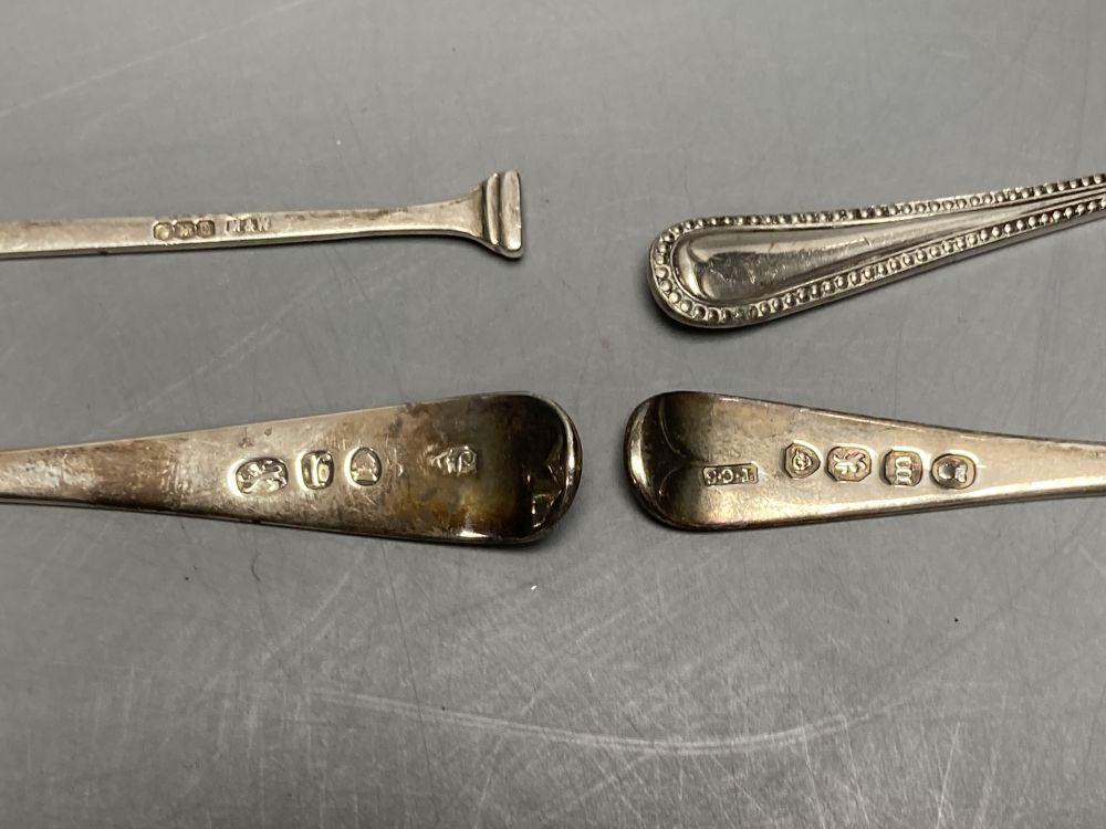 A pair of Georgian silver circular salts, a George III urn-shaped pepper pot and 4 various spoons.